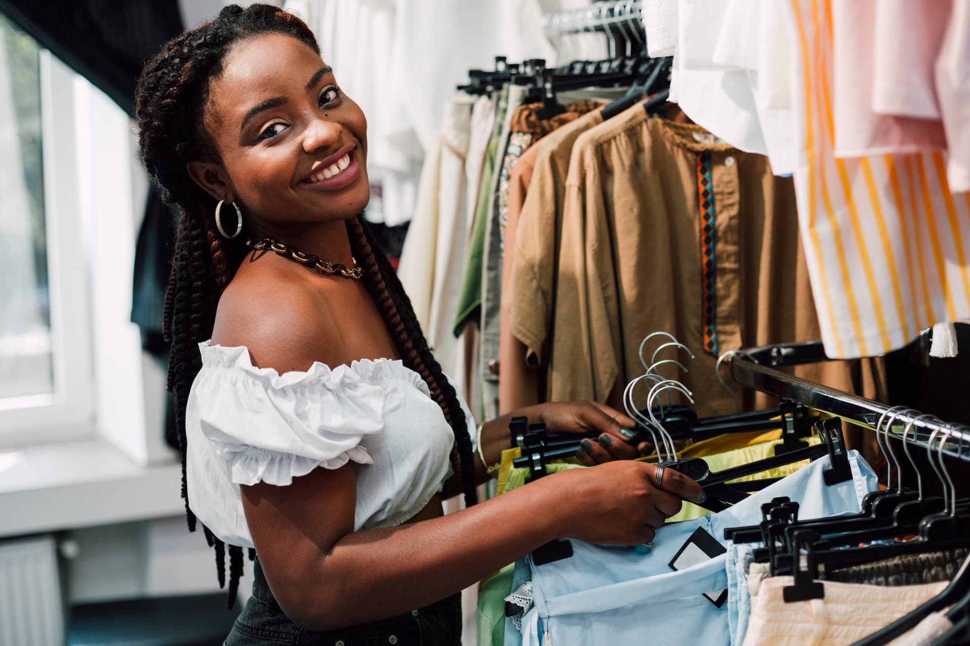 A Kenyan shop owner in her store
